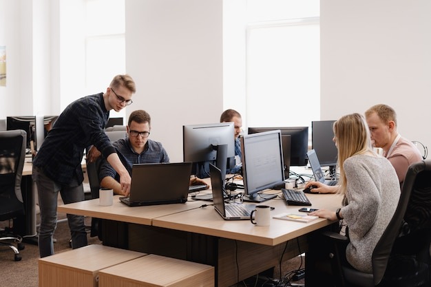 Developer working on code across multiple screens