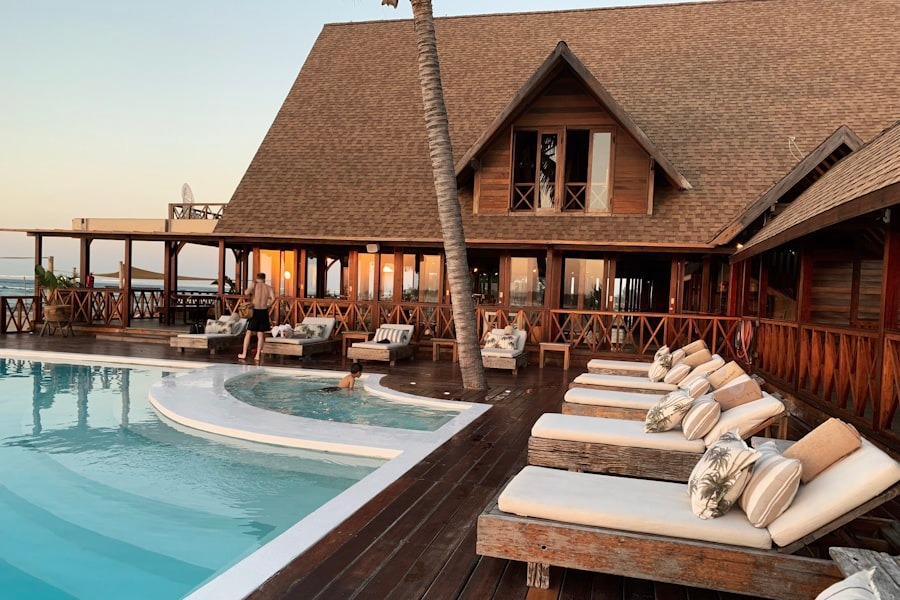 Hotel exterior with pool at dusk